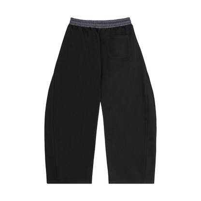 Black barrel sweatpants with plaid waistband, front drawstring, side pocket