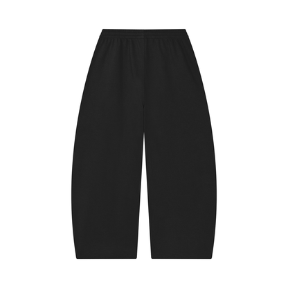 Unisex barrel-leg pants in black with elastic waistband, back view