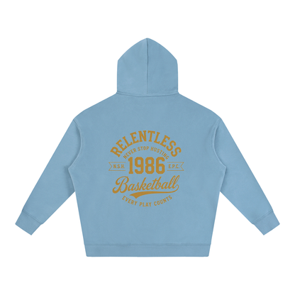 Oversize fleeced hoodie, light blue; back features large “Relentless 1968 Basketball” graphic