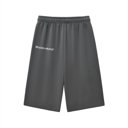 Charcoal gray three-quarter sweatpants with elastic waistband and drawstring, small left logo