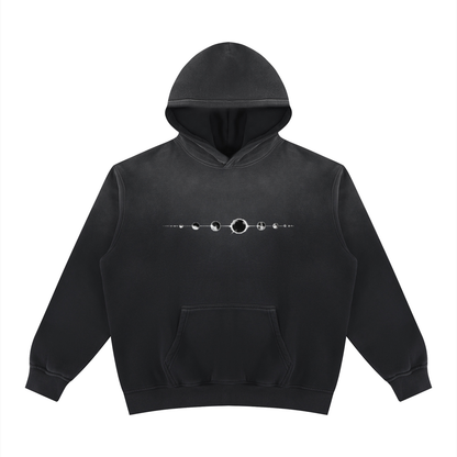 Black fleece hoodie with hood, pouch pocket, and front silver ring graphic
