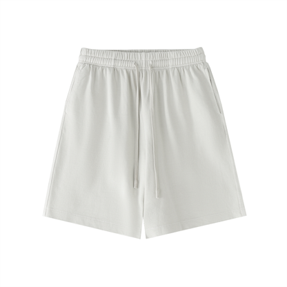 Off-white cotton drawstring shorts with elastic waistband and relaxed straight legs
