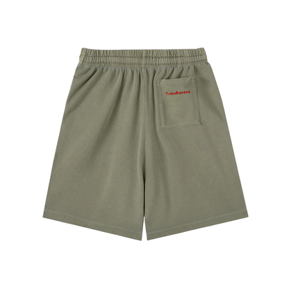 Army green cotton shorts with elastic waist, drawstring, and side chest pocket