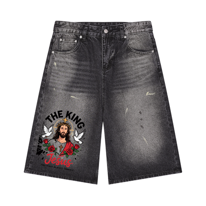 Black wide-leg denim shorts with vintage wash and Jesus graphic on panels