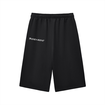 Black three-quarter sweatpants with elastic waistband and drawstring, small left logo