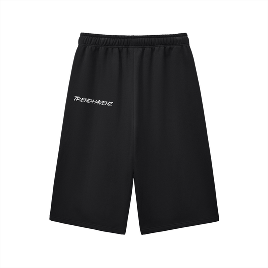 Black three-quarter sweatpants with elastic waistband and drawstring, small left logo