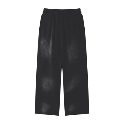 Black loose-fit cotton sweatpants with elastic waist, drawstring, side pocket