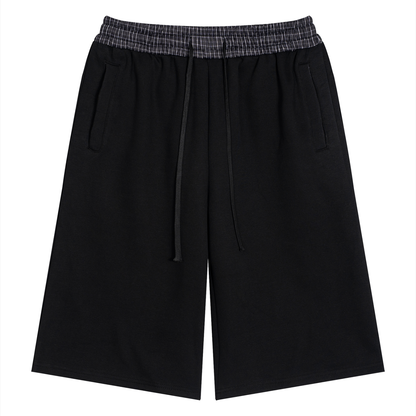 Black unisex shorts with plaid elastic waistband and adjustable drawstring