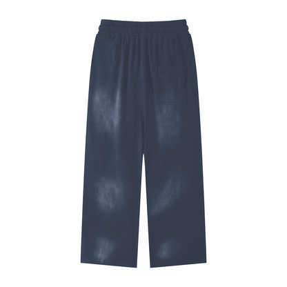 Blue cotton sweatpants with elastic waistband and side patch pocket