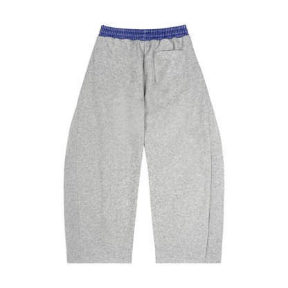 Heather gray barrel sweatpants with blue plaid waistband and drawstring, no visible pocket