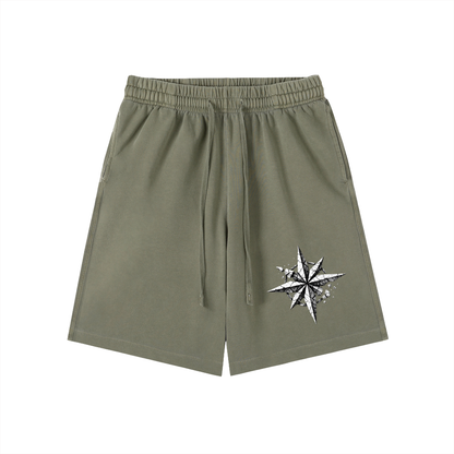 Olive vintage-wash cotton shorts with elastic waistband, drawstring, and side star graphic.
