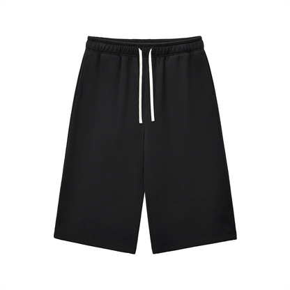 Black relaxed three-quarter sweatpants with elastic waistband and white drawstring