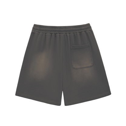 Dark gray cotton shorts with elastic waistband, drawstring, back pocket, raw hem, sun-fade.