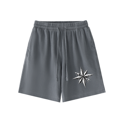 Charcoal gray vintage-wash cotton shorts with elastic waistband, drawstring, and side star graphic.