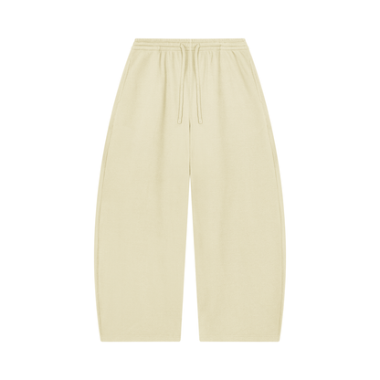 Unisex barrel-leg pants in oat-cream with elastic waistband and drawstring