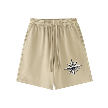 Khaki vintage-wash cotton shorts with elastic waistband, drawstring, and star graphic
