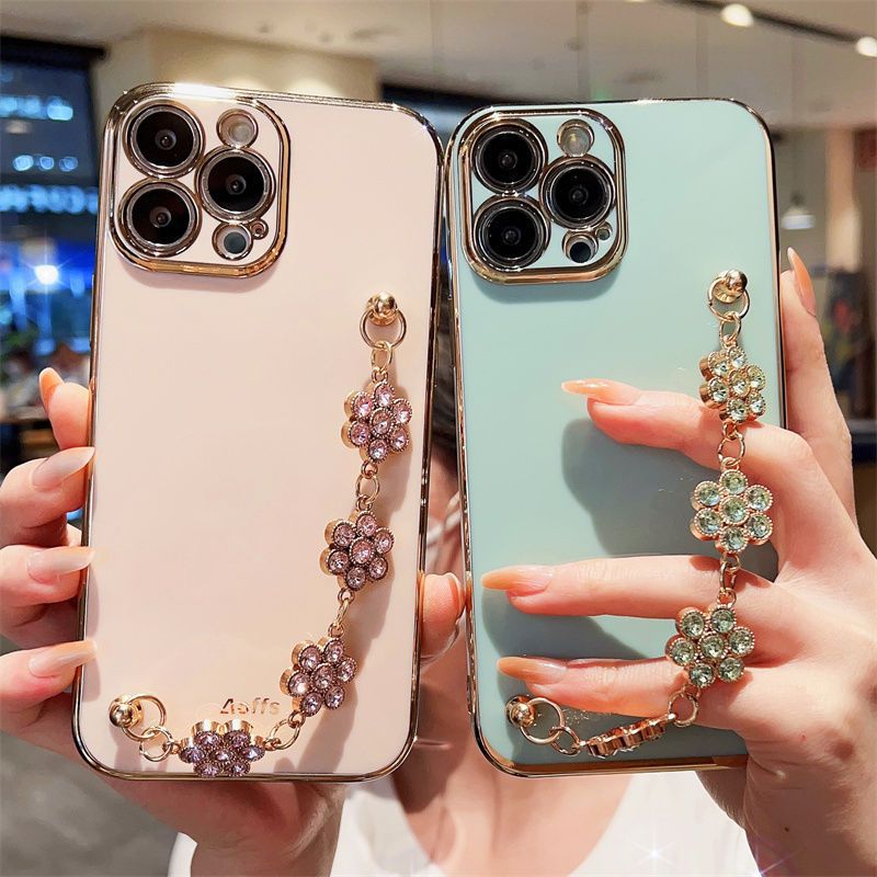 Set of phone cases with rhinestone bracelet straps, pastel pink and mint with gold-tone chains