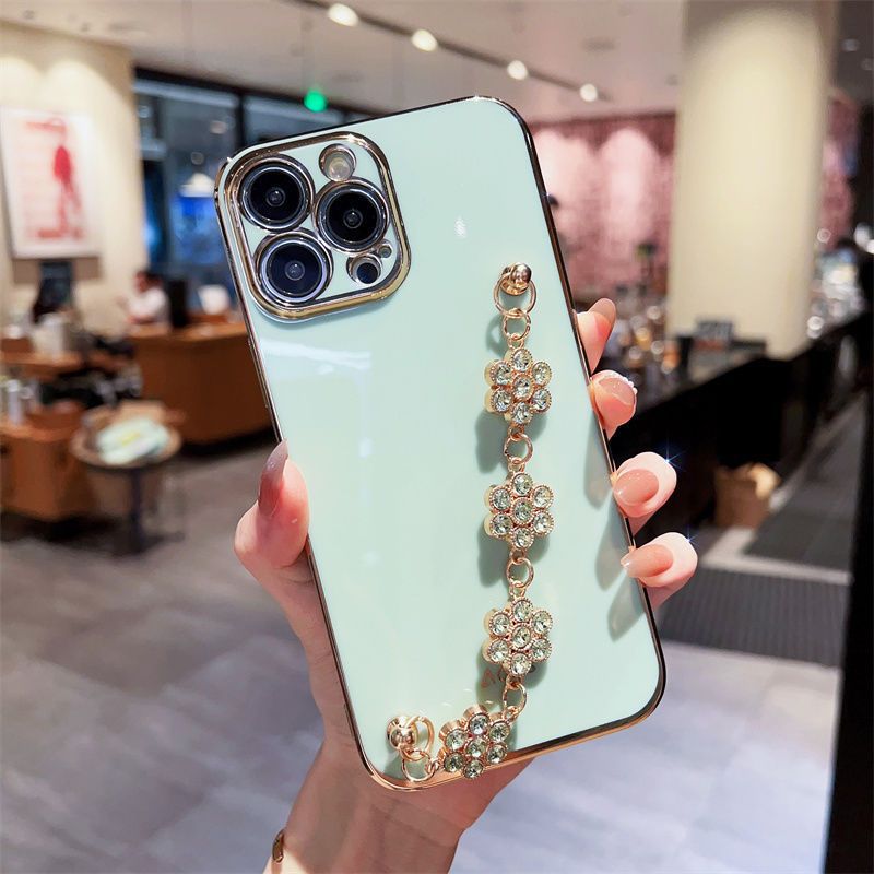 Light blue phone case with light rhinestone floral wrist bracelet chain