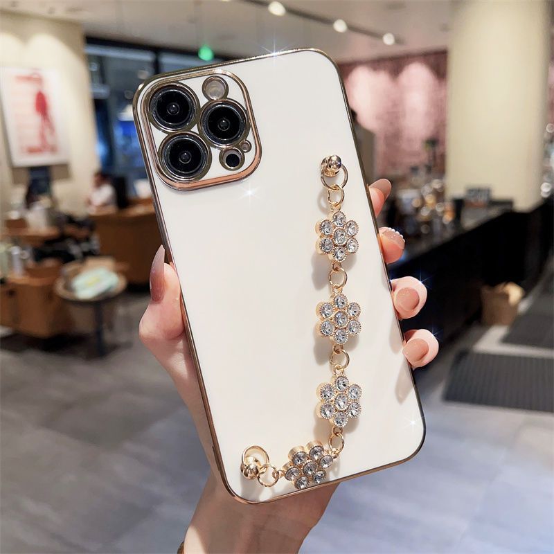 White phone case with silver rhinestone floral wrist bracelet chain