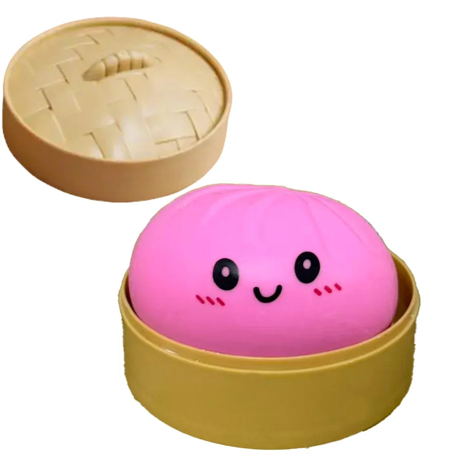 Pink dumpling squishy in gold rim container with cute smiling face