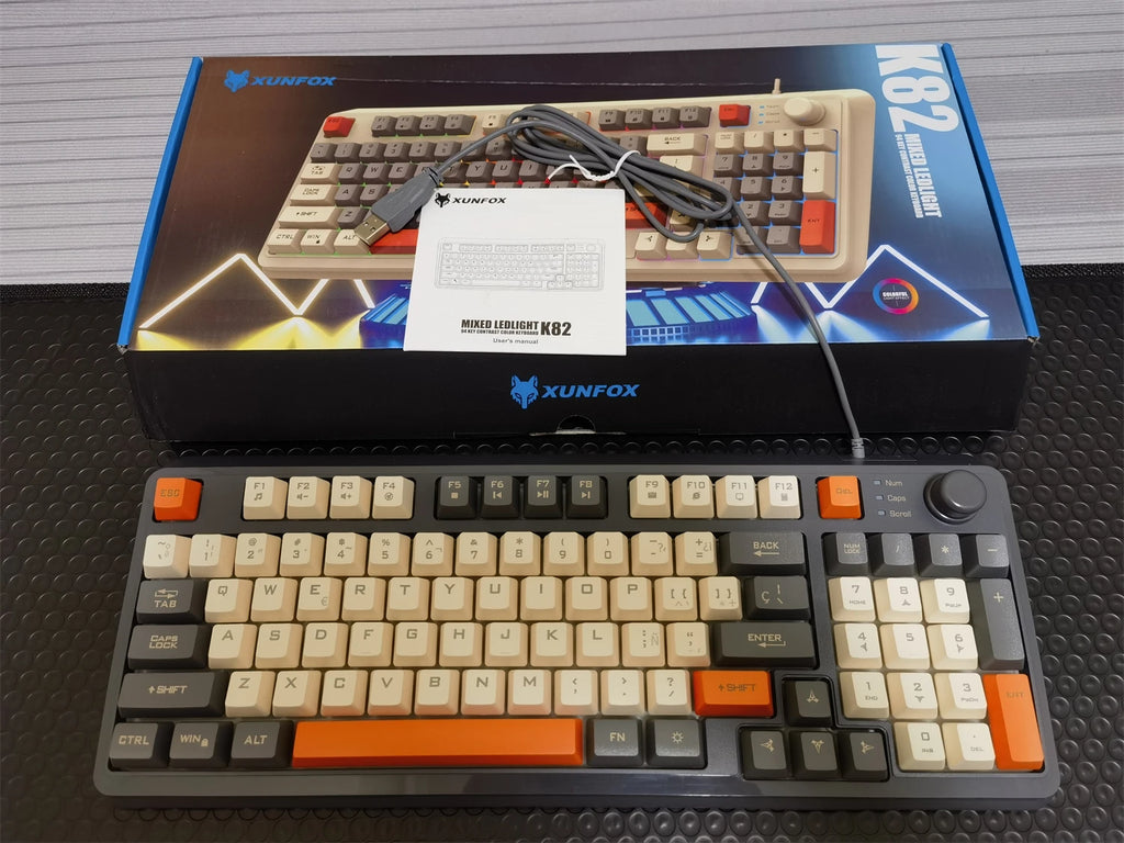 94-key wired keyboard with cream and black keys, orange accents, RGB backlight, knob