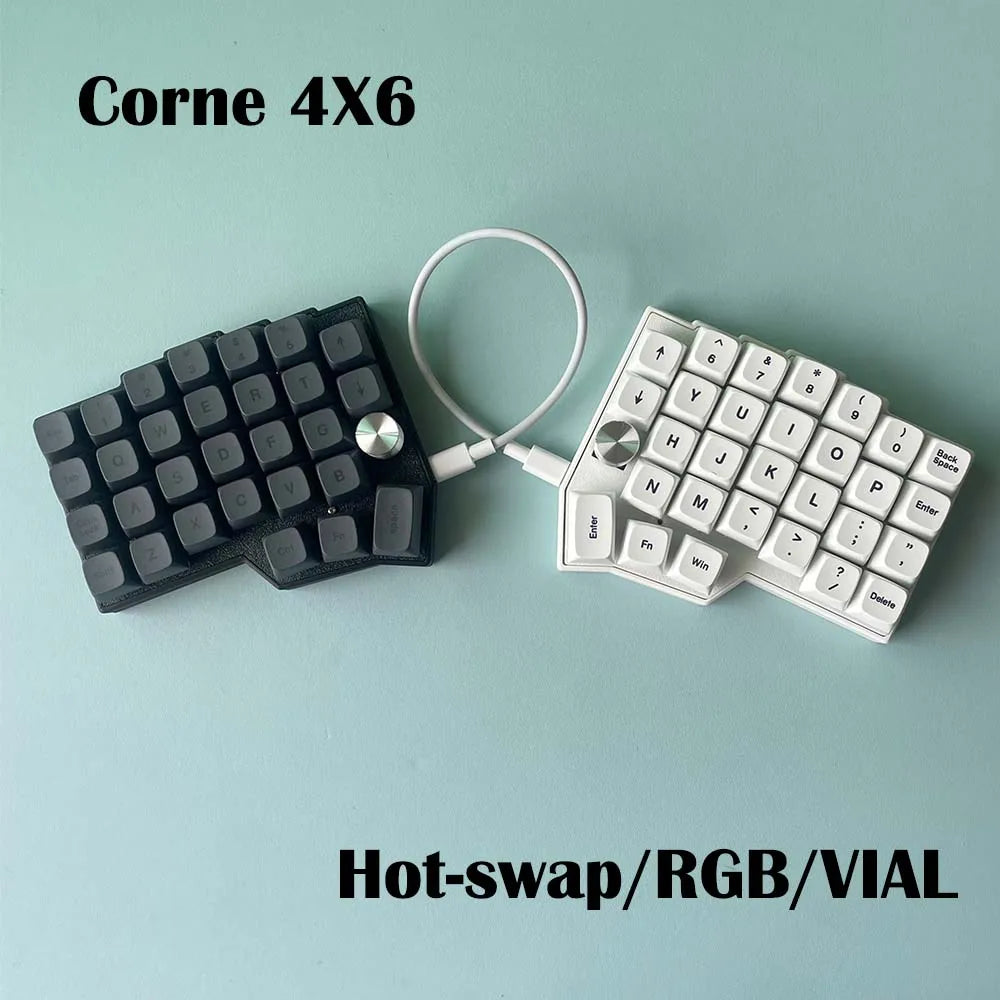 Corne 4x6 split keyboard with black and white keycaps and rotary knobs, wired