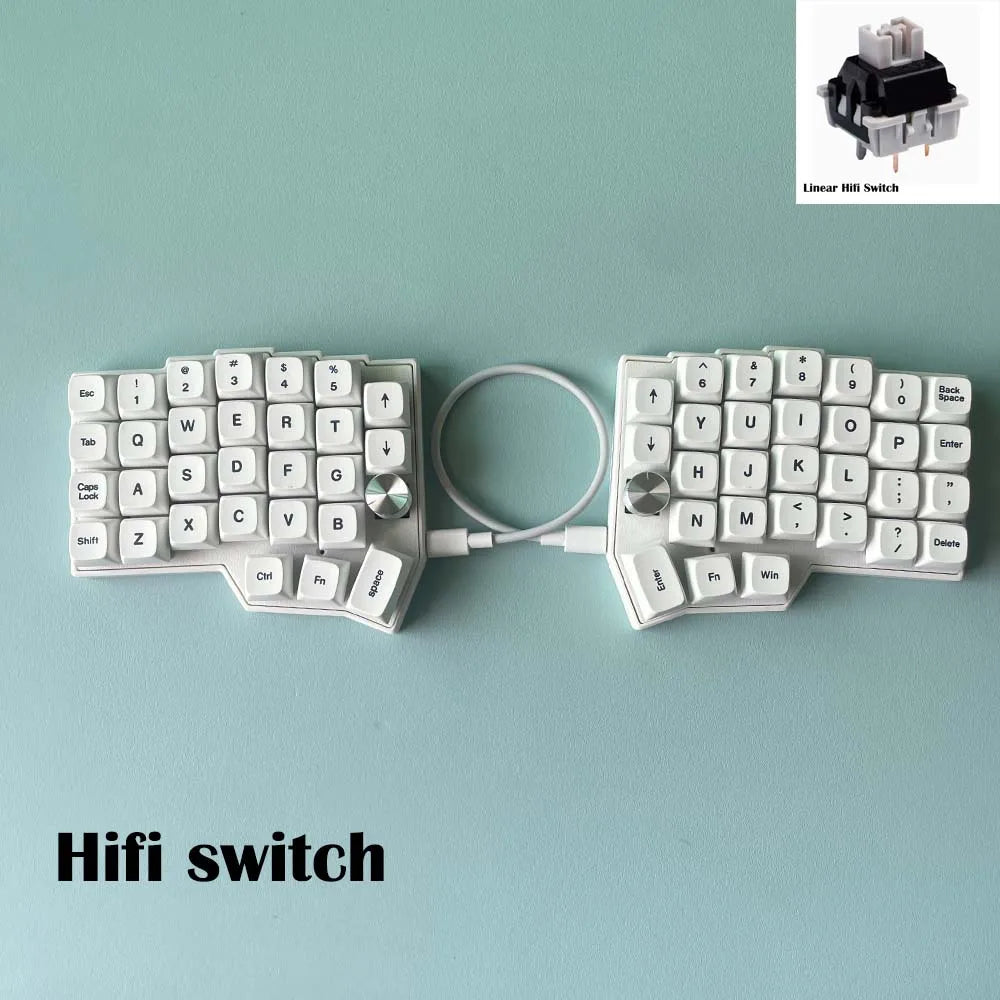 Split ergonomic keyboard with white keycaps, two knob modules, and connected cable
