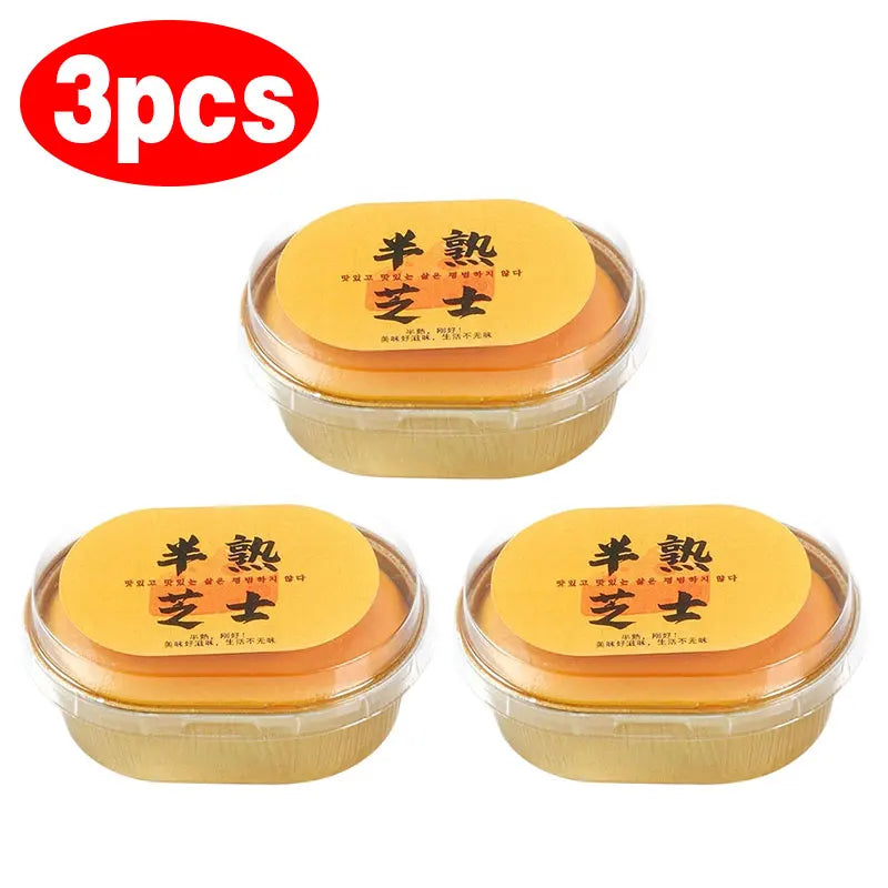 Three packaged cheese-shaped squishy toys in clear round containers with yellow lids