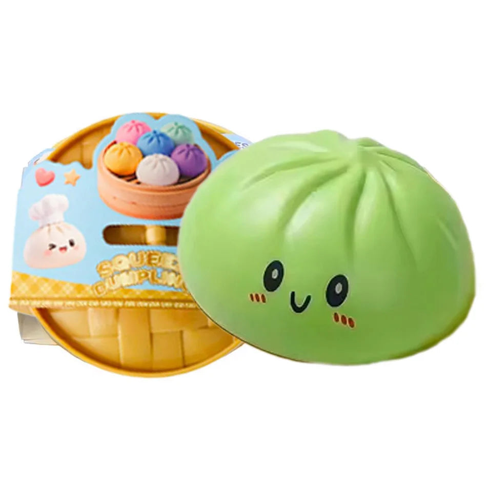 Green squishy dumpling character with smiling face next to packaged set