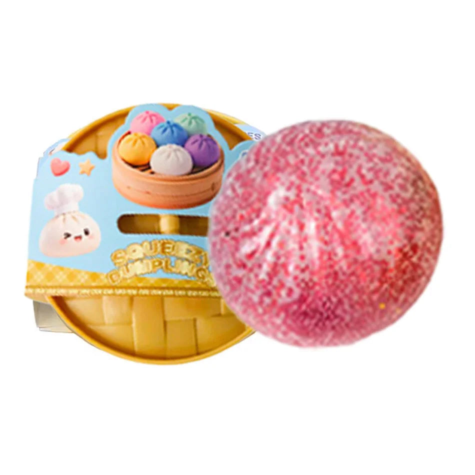 Pink glitter squishy dumpling character next to packaged set
