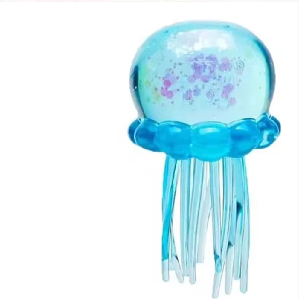 Blue jelly-like squishy toy with clear dome top and dangling tentacles