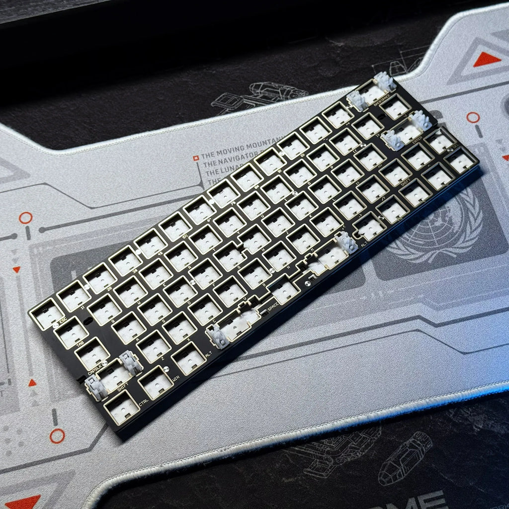 Keyboard PCB with white switch sockets and silver LED components, angled view
