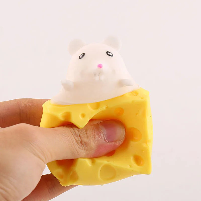 Cheese squishy toy shaped like a yellow cheese slice with a white mouse face topper