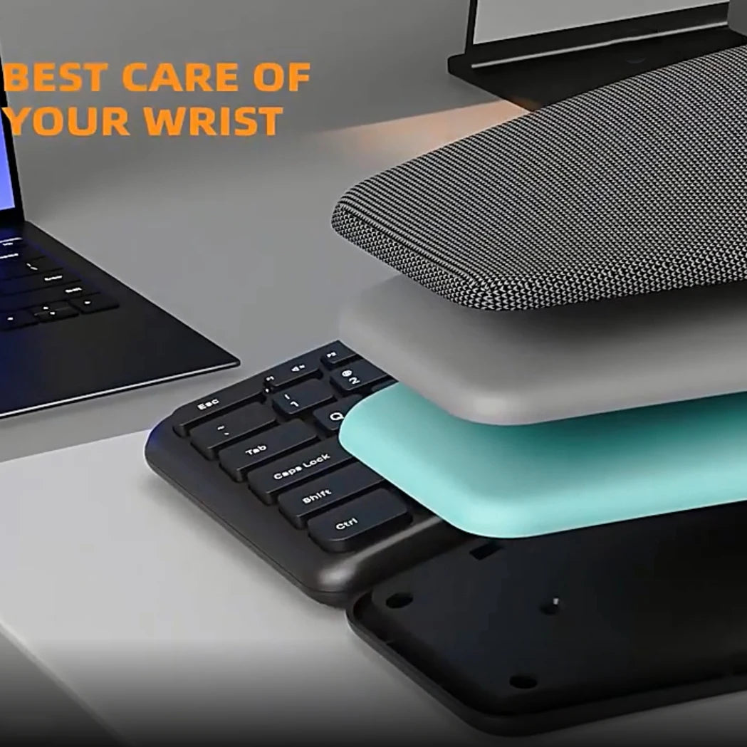 Black ergonomic keyboard underside with cushioned palm rest and fabric-texture wrist area