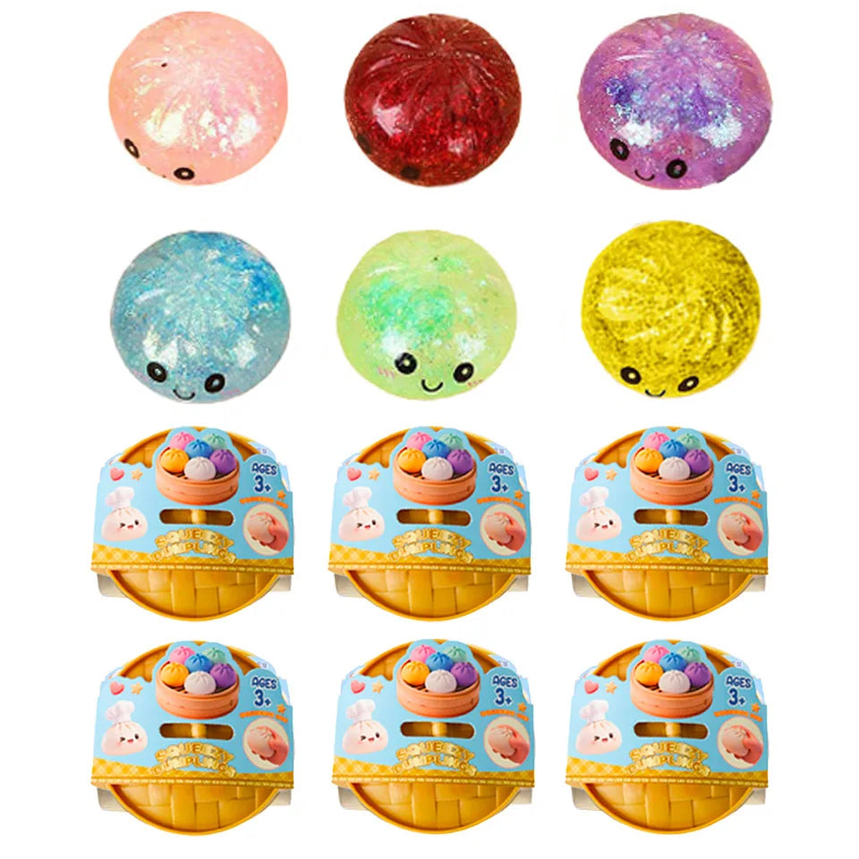 Assorted glitter squishy dumpling faces with boxed set trays below