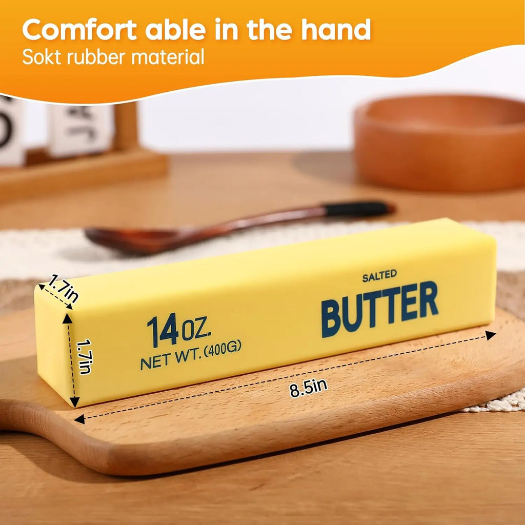 Yellow butter-shaped squishy fidget toy on wood board, 14oz size text