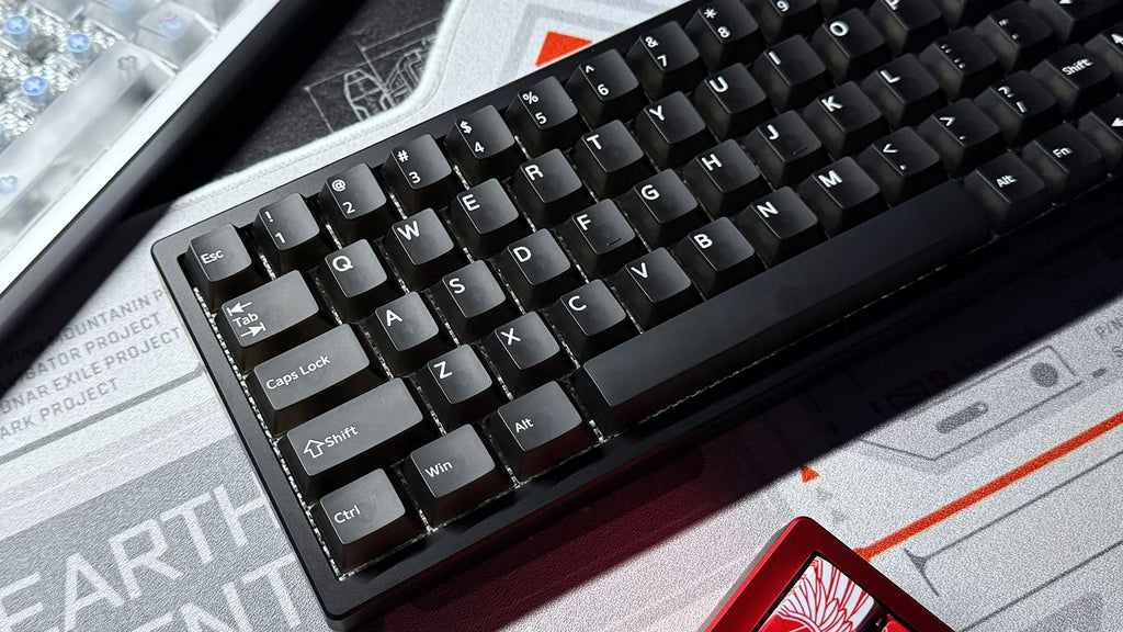 Mechanical keyboard with black keycaps and white legends