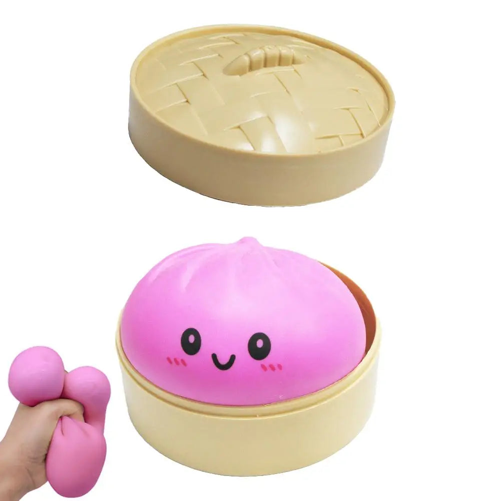 Pink dumpling squishy bun in tan snap-lid container with hand squeezing