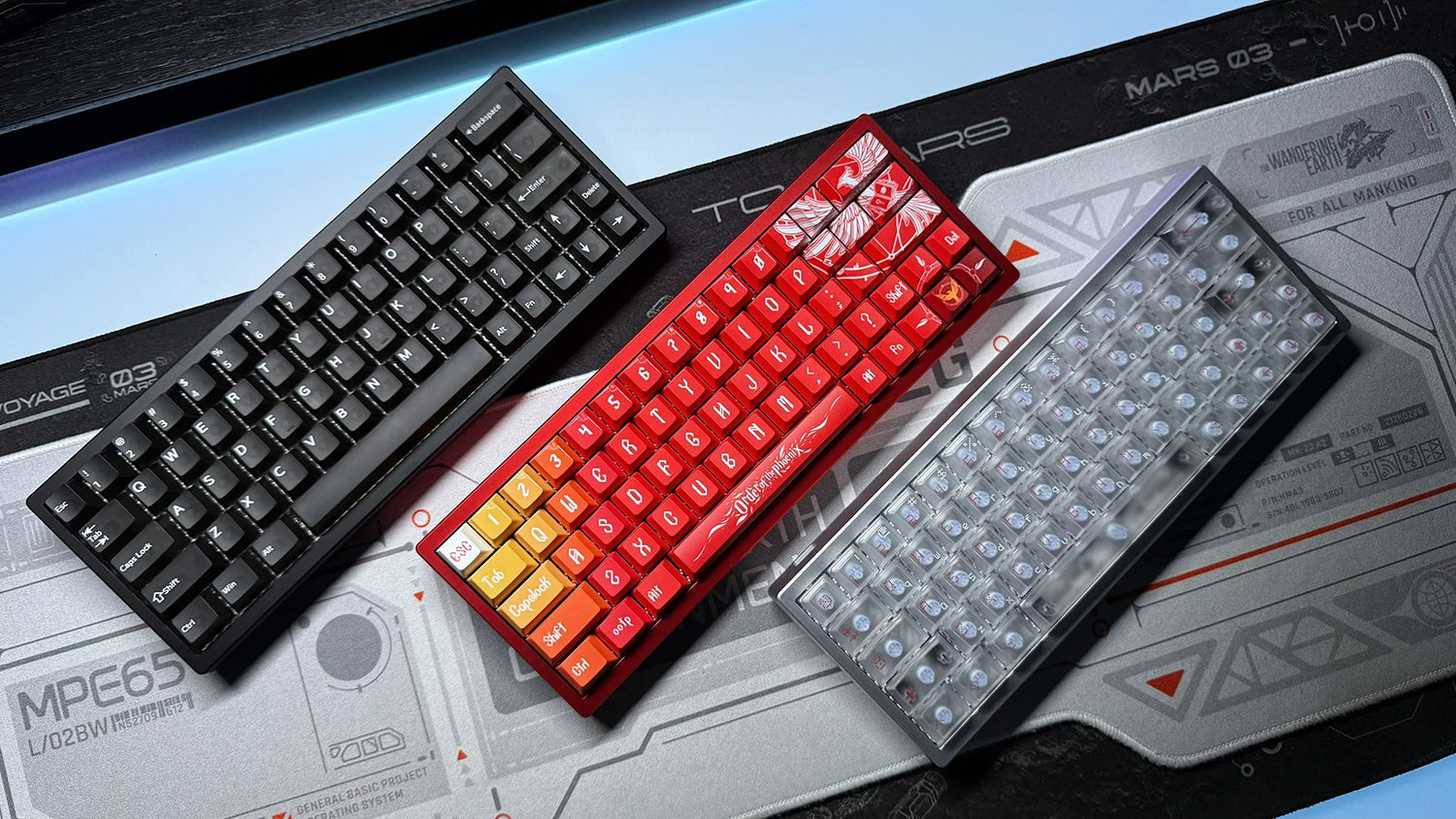 Keyboard PCB kit with black, red, and clear switch housings on a tray
