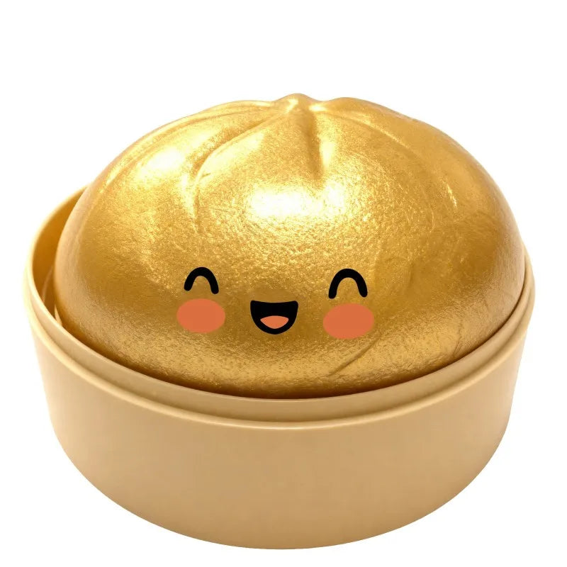 Gold metallic dumpling squishy fidget ball ornament with smiling face, in golden base