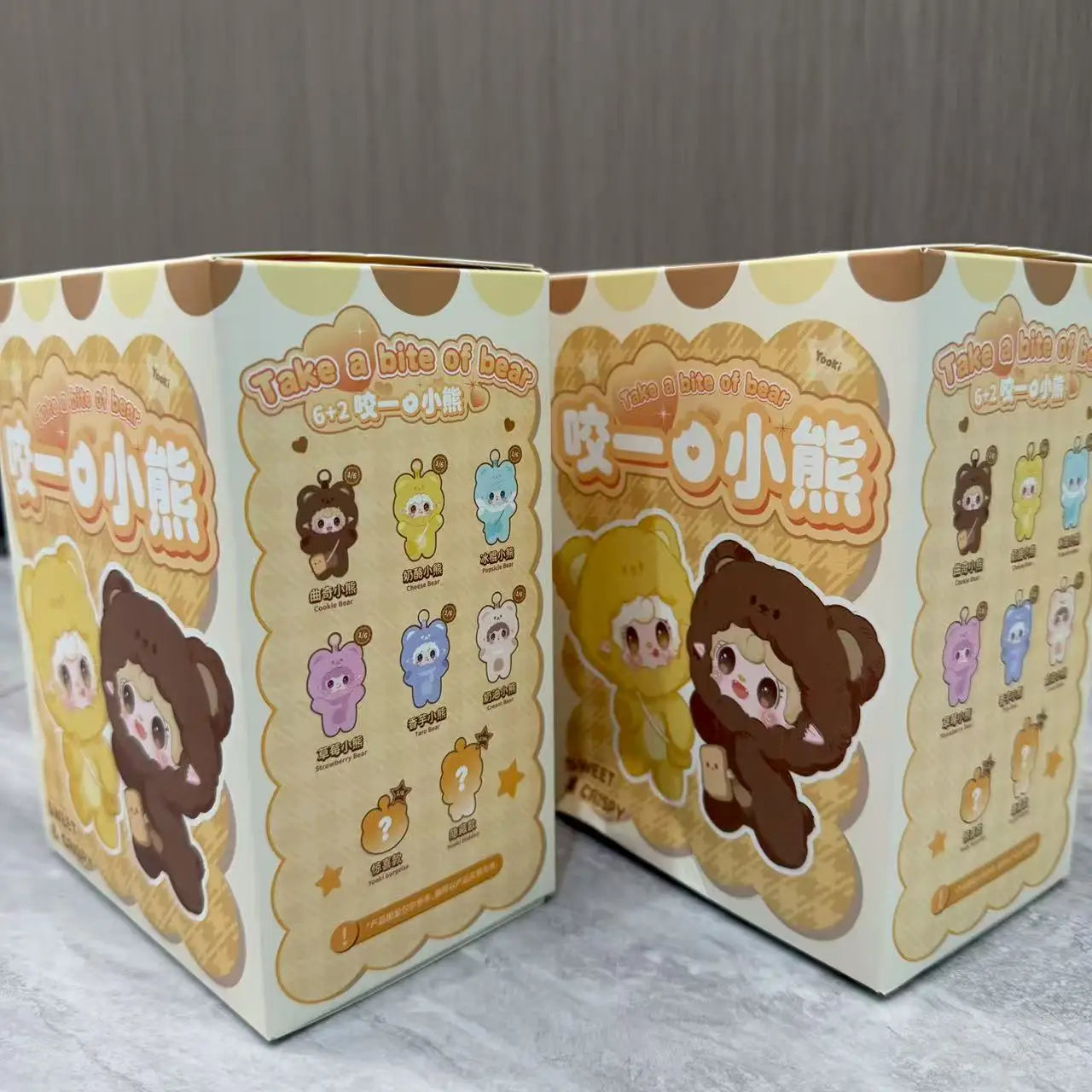 Set of two cardboard boxes for sensory cube toy with bear character theme and icons.