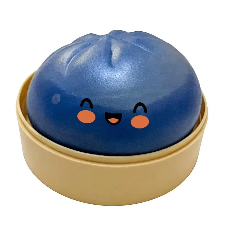 Blue dumpling squishy fidget ball ornament with smiling face, in gold base