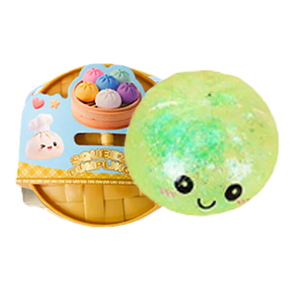 Green squishy dumpling character with smiling face next to packaged set