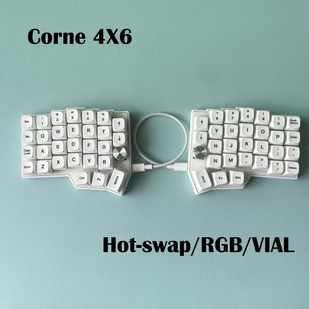 Corne 4x6 split mechanical keyboard with white keycaps and rotary knobs, wired