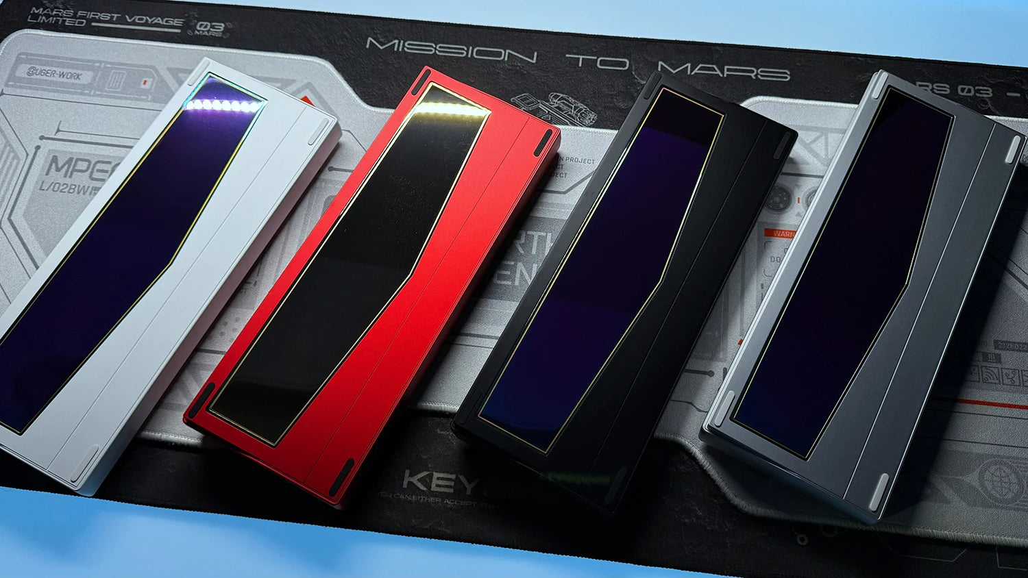 RGB keyboard PCB kit with red, black, and gray cases and deep blue legends