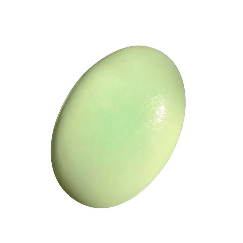 Light green oval squishy toy with smooth surface and subtle shine, slow rebound.
