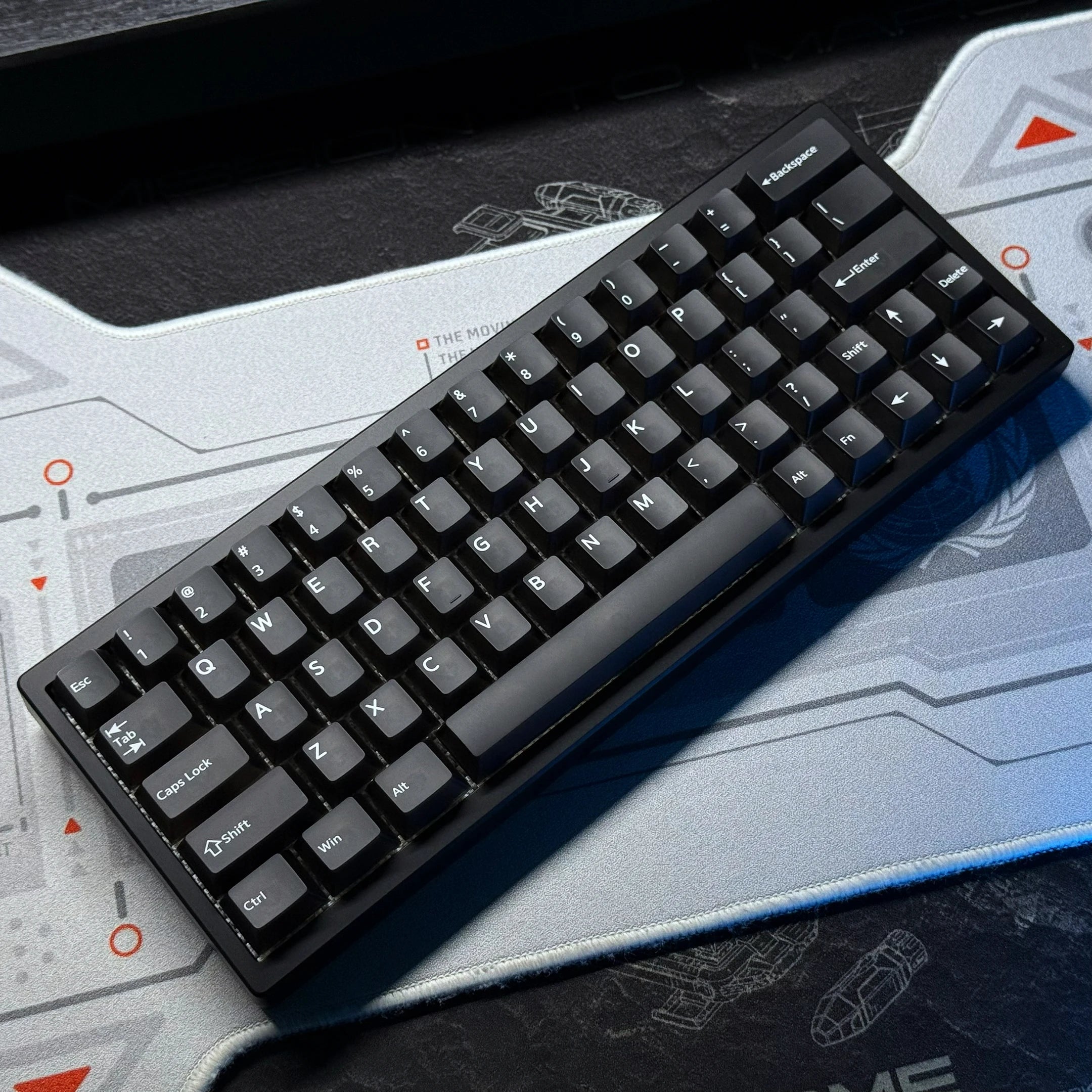 Black keyboard PCB kit with black keycaps and white lettering