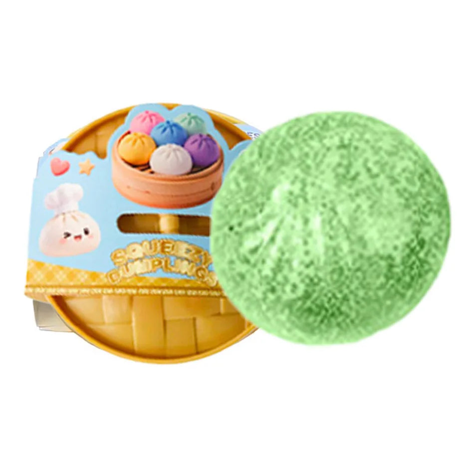 Green glitter squishy dumpling character next to packaged dumpling set