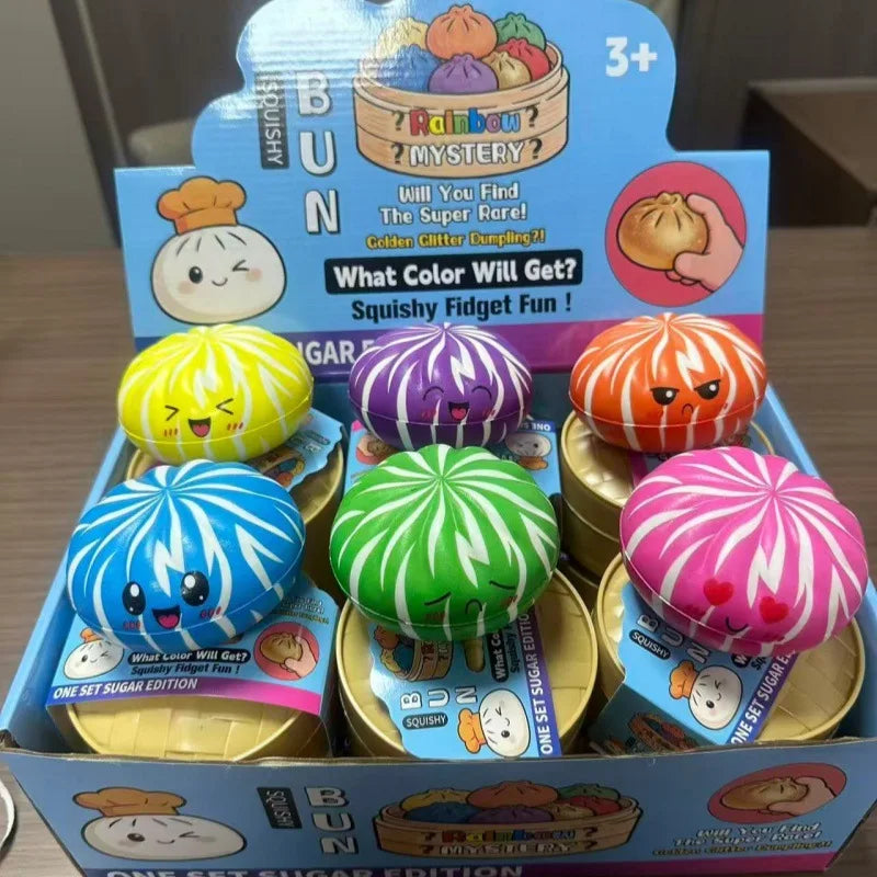 Assorted colorful dumpling squishy fidget balls displayed in a store box