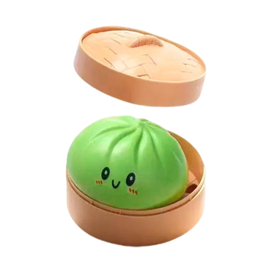 Orange-brown squishy bun stress ball with green face in open steamer top